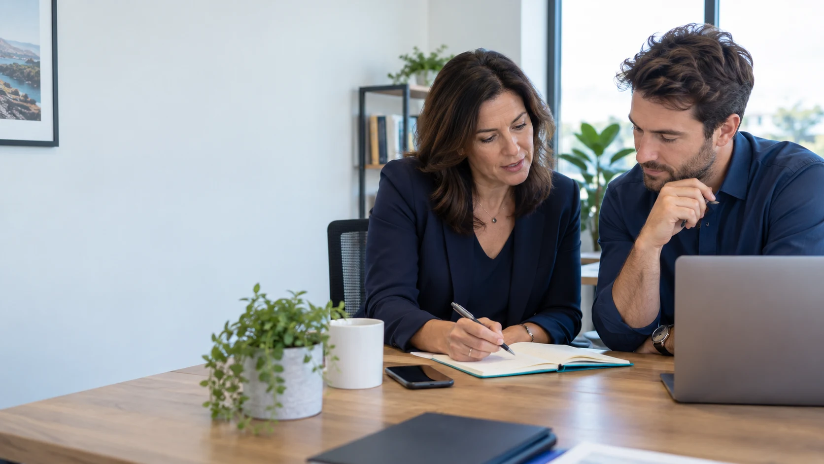Sales colleagues reviewing discovery notes together